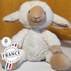 Bouillotte peluche mouton aux grandes oreilles chauffante, remplie de blé et de lavande, distribuée par Acaponcho, fabriquée en France pour une chaleur douce et réconfortante.