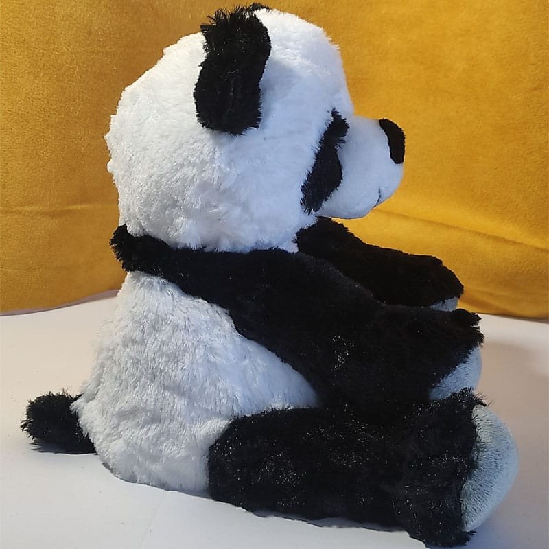 Bouillotte peluche panda chauffante, remplie de blé et de lavande, vendue par Acaponcho, fabriquée en France pour une chaleur apaisante et naturelle.